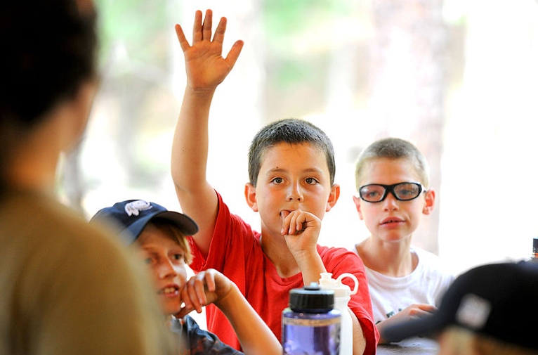 Boy asking a question Goshen Cub Scouts camp