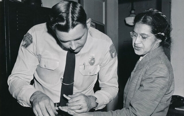 Rosa Parks being fingerprinted after bus protest